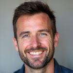 Portrait of Cian O'Connor, Master Tiler, with a focused expression.